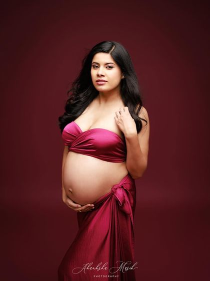 A simple wrap of deep pink fabric creates a beautiful, minimalist look that is both elegant and powerful.