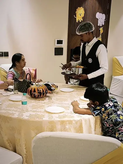 My team serving guests at a housewarming party for 50 people in DLF Phase 2. I ensure every guest is attended to, making the experience seamless for the hosts.