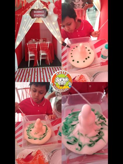 The classic "Elephant Toothpaste" experiment is always a hit. At this carnival-themed science station, a young boy watches in amazement as a foamy volcanic eruption happens right before his eyes.