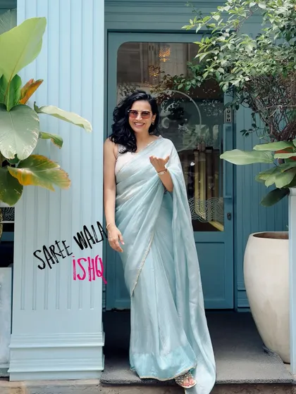 The same beautiful photo with a "Saree wala ishq" text overlay. This version is perfect for social media stories or reels, adding a touch of personality to the elegant image.