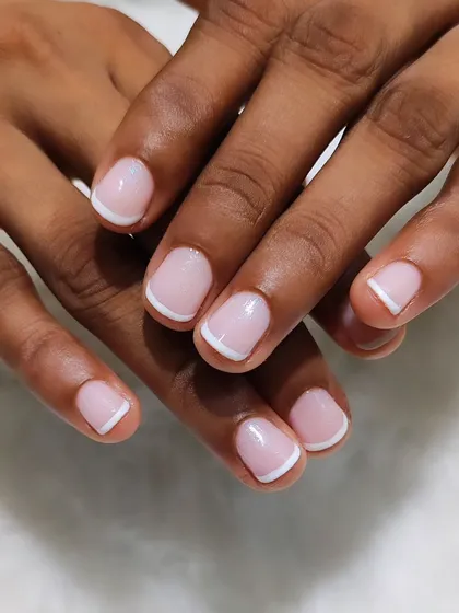 Proof that the French manicure is perfect for any nail length. Here is a clean and classic French look on short, natural nails for a polished and timeless style.