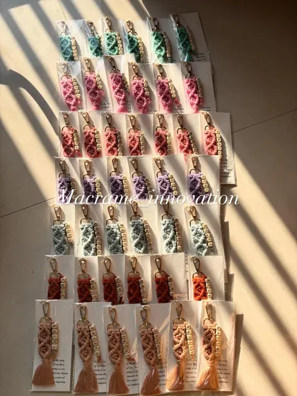 Another angle of a colorful bulk order of personalized keychains, catching the sunlight.