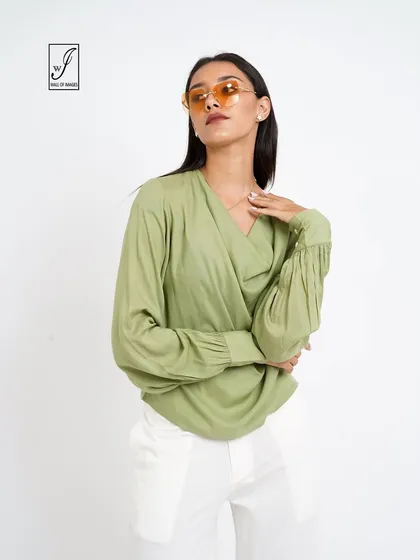 A variation of the pose, showing the wrap detail of the top.