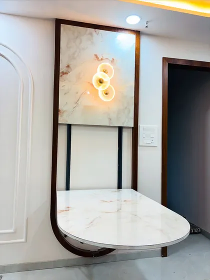 The folding dining table fully set up, creating a cozy dining nook. This demonstrates my ability to create multi-functional spaces in modern homes.