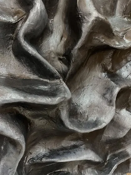 Texture is something you should want to reach out and touch. This is a close-up of a sculptural piece where I created deep, fabric-like folds, showing how texture can add incredible depth and character to a monochrome artwork.