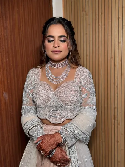 A close-up of this stunning engagement look. The focus is on a dramatic smokey eye and contoured cheeks, creating a bold and beautiful style for the evening.