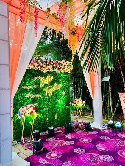 The photo booth as part of the larger entrance decor, creating a cohesive and festive look.