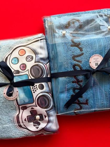Our personalised gamer towels, all wrapped up and ready to be gifted. They make fantastic return favors for a video game-themed birthday party.