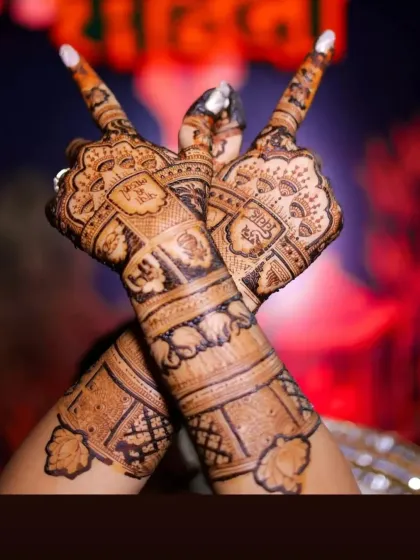A duplicate image showing the beautiful symmetry and detail of the back-hand mehandi design.