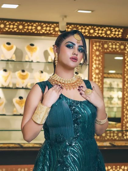 A full shot of the green gown and gold jewellery look. Portfolio shoots like this help my students build a diverse and professional book of work.