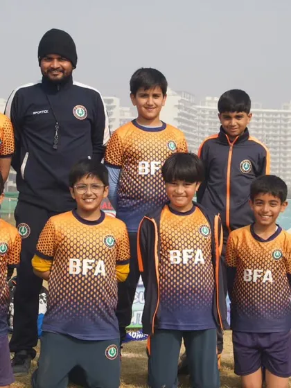 The Bharat F.A. Under 10 Blue Cubs, celebrating their championship title. Their passion for the game shines as brightly as their medals.