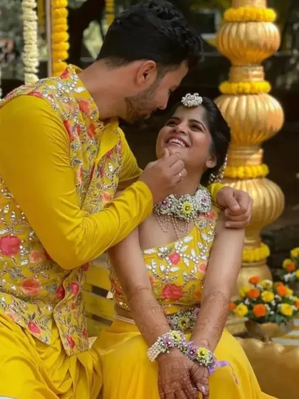 A sweet moment between the happy couple, Amruta and Prasad, during their Haldi. We created a full floral set for Amruta, including a choker, matha patti, and haath phool.