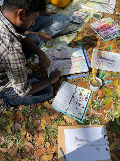 This is what a perfect Sunday looks like to us: surrounded by fallen leaves, sunlight, and fellow artists, with palettes full of color.