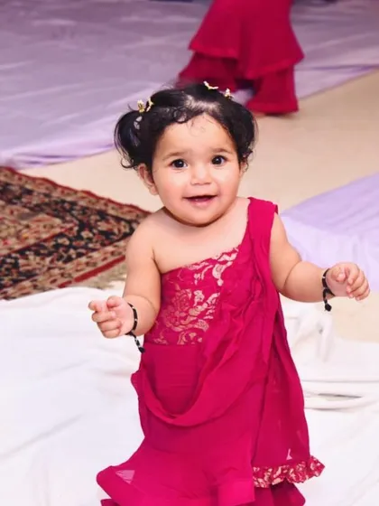 Here is a closer look at the adorable custom gown for a client's first birthday. I designed it to be a miniature version of her mother's dress, ensuring it was comfortable for her to move and play in while looking absolutely precious.