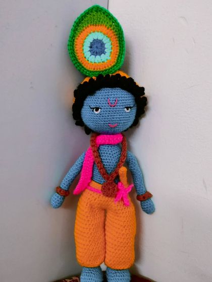 Another beautiful Lord Krishna doll I made. He has his flute, a necklace, and a peacock feather in his hair.