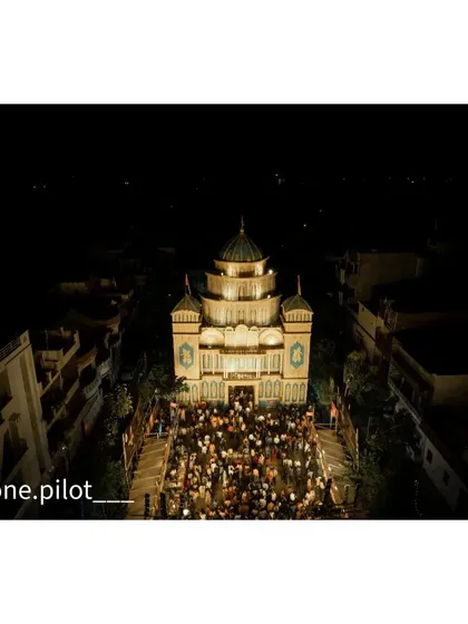 Capturing the crowd of devotees gathered in front of an ornate pandal. The drone gives a great perspective on the scale of the celebration.