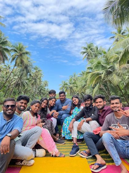 A large, happy group enjoying the scenic boat ride through Honnavar's mangrove forest.
