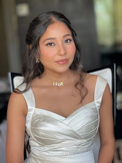 A close-up of Yogini's makeup. We focused on a soft brown smokey eye and a glossy nude lip for a sophisticated and modern style.