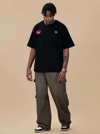 The front of the 'World of Lovers' tee, showing the relaxed, oversized fit and the small chest logo details.