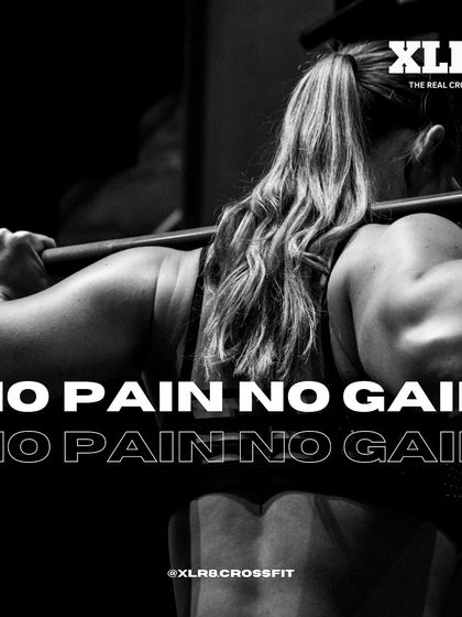 No Pain No Gain. A powerful black and white shot of a woman squatting heavy weight.