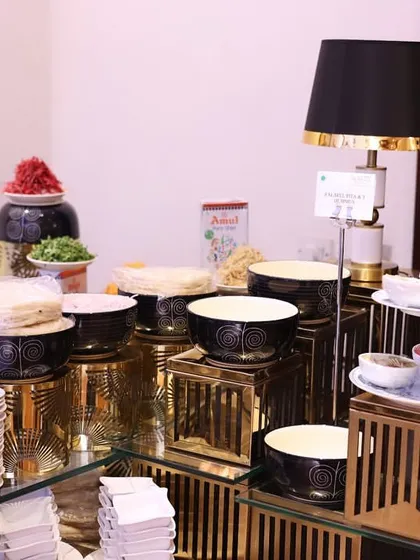 Another angle of our chaat station, highlighting the variety of ingredients and condiments on offer. Everything is laid out for easy access while maintaining a clean and organized presentation.
