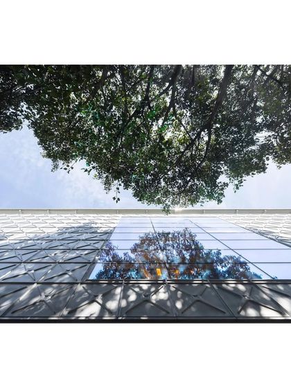 An upward-looking shot of the MAP facade from the Dezeen feature.