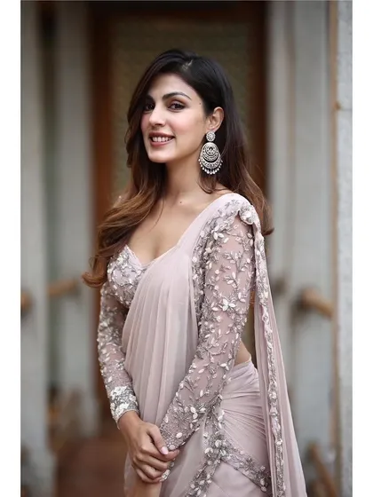 This ruffled saree by Shloka Khialani is a fun and flirty take on the classic. The dusty pink color and tiered ruffles make it a great choice for a cocktail party or reception.