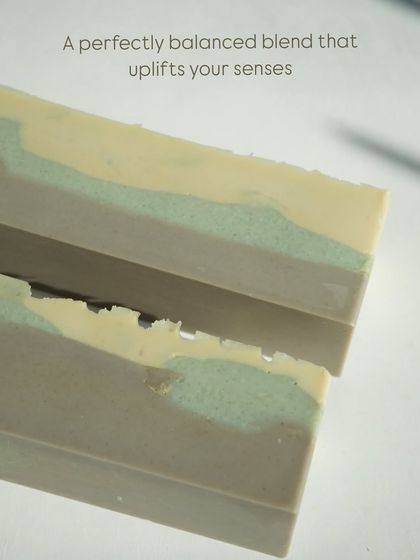 A close-up of the soap loaf before cutting, showing the different clay layers.