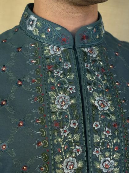 The jacket is beautifully adorned with multicoloured intricate Resham silk embroideries, creating a luxurious and elegant look for any occasion.