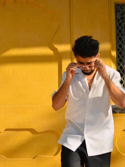 Adjusting my glasses between songs. The life of a performing artist captured in a candid moment at a Rajasthan wedding.