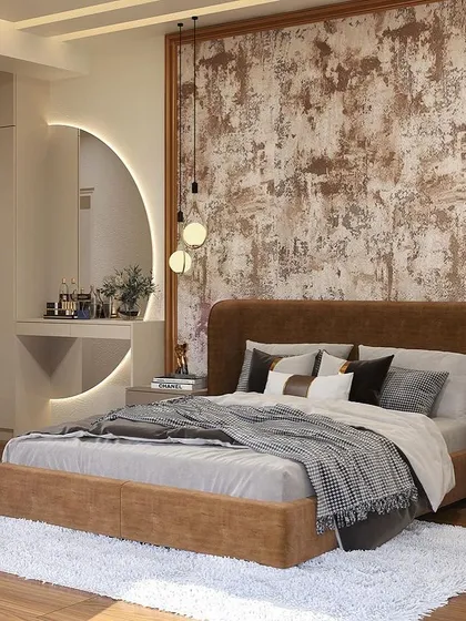 This bedroom is designed to feel both luxurious and comfortable. The focal point is the rustic, textured wallpaper behind the bed, which contrasts beautifully with the sleek, backlit circular mirror and modern pendant lights.