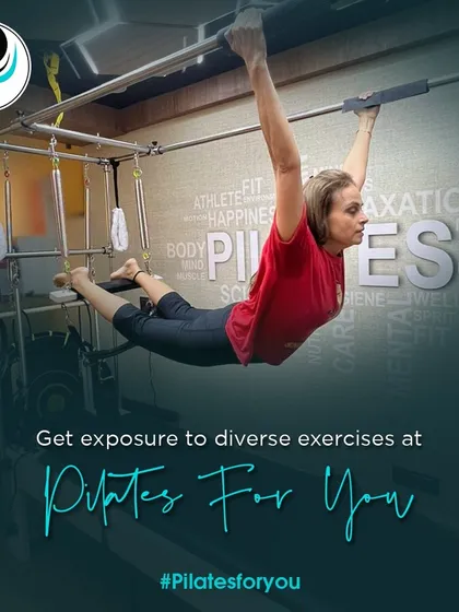 Get exposure to diverse exercises in my studio. This client is performing a hanging pull-up on the Cadillac, a testament to the strength that can be built through Pilates.