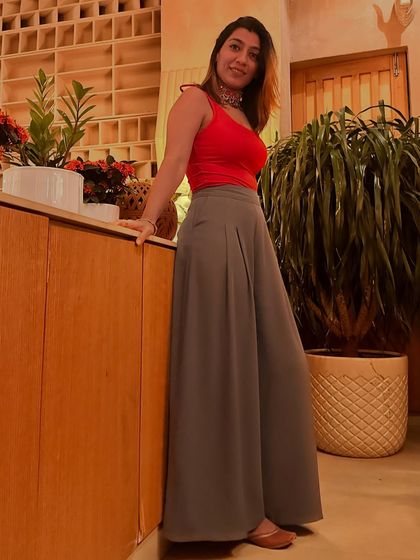 Breaking the rules by pairing flowy trousers with traditional juttis. This look is about mixing modern and traditional elements for a unique and comfortable style.