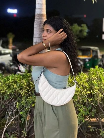 A customer looking chic with her quilted white Selena bag. It’s wonderful to see how our community styles their Mistry pieces.