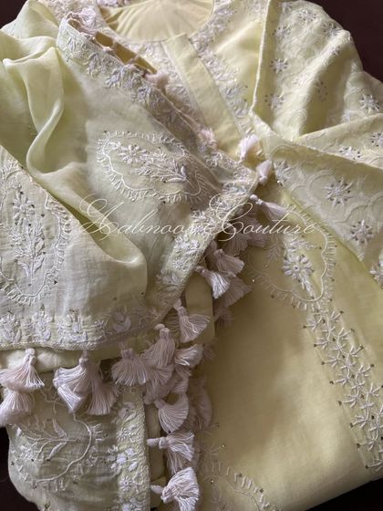 A detail shot of the playful tassels that adorn the edges of the kurta and dupatta.