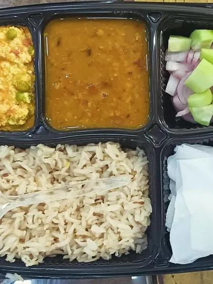 A healthy meal option with Paneer Bhurji, yellow dal, and nutritious brown rice. I can substitute white rice with brown rice upon request for a healthier meal.
