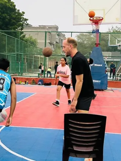 A French coach demonstrating a drill during our basketball clinic. This hands-on, international coaching provides a unique learning experience for our athletes.