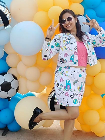 A fun and playful pose. I believe in bringing a sense of fun to everything I do, including my photoshoots.