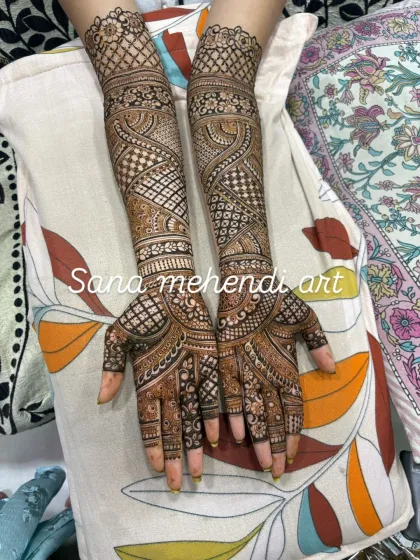 Master the art of full bridal mehendi, a key skill for any professional artist. This design showcases a blend of techniques you will learn, including intricate checkerboard fillers (jaali), delicate floral bands, and symmetrical paisley patterns that cover the entire forearm.