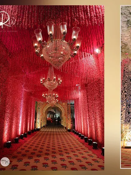 A grand entrance tunnel created with thousands of red carnations and multiple crystal chandeliers, leading to a traditional wedding.