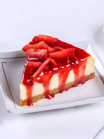 Another look at a slice of my Strawberry Cheesecake, with the rich, red strawberry topping dripping down the sides. It's as delicious as it looks.