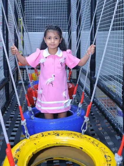 Navigating the tire bridge! This obstacle requires balance and coordination, making it a fun and rewarding challenge for adventurous kids.