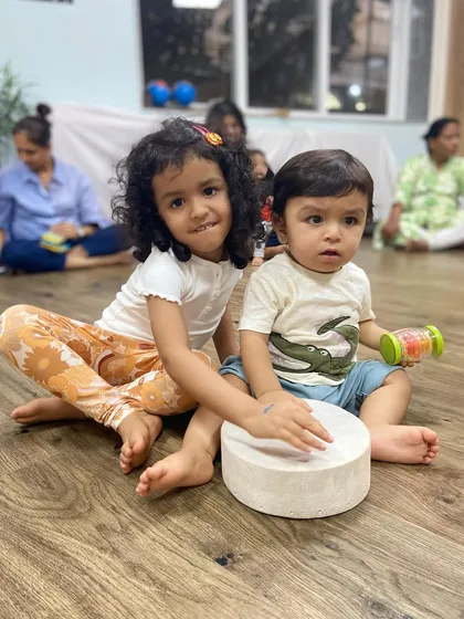 Music brings everyone together, including siblings. It's so special to see an older sister and younger brother sharing a drum and making music as a family.