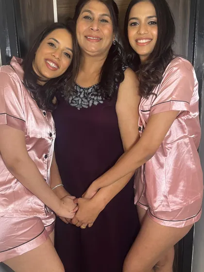 The bridesmaids with their mother. A beautiful family moment captured before the festivities begin.