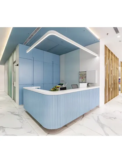 For the Lilavati Clinic, the goal was to create a space that feels calming and reassuring. The reception area uses a soft blue palette, curved forms, and clean white marble to establish a serene and professional environment for patient wellness from the moment they arrive.