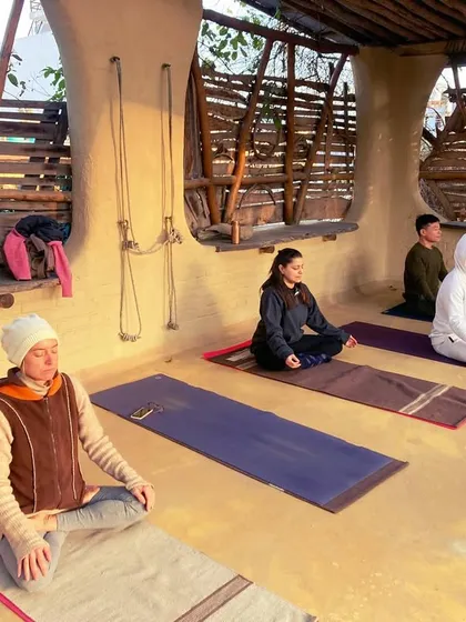 "Atha yoga anushasanam." Now, I begin my life with the discipline of yoga. A moment of meditation on a beautiful rooftop, ready to start the practice.