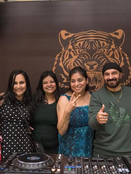 Posing with some fans at the DJ booth at Badmaash.