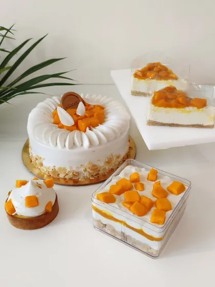 A showcase of our seasonal mango collection, featuring a Mango King Cake, tarts, cheesecakes, and dessert jars. I use the freshest fruits of the season to create these limited-time delights.