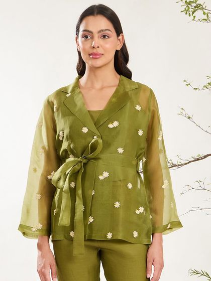 A closer look at the olive green organza jacket, highlighting its wrap-style design and delicate embroidery.