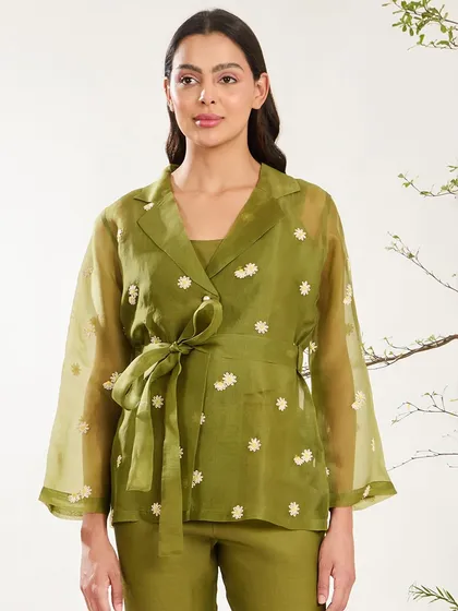 A closer look at the olive green organza jacket, highlighting its wrap-style design and delicate embroidery.